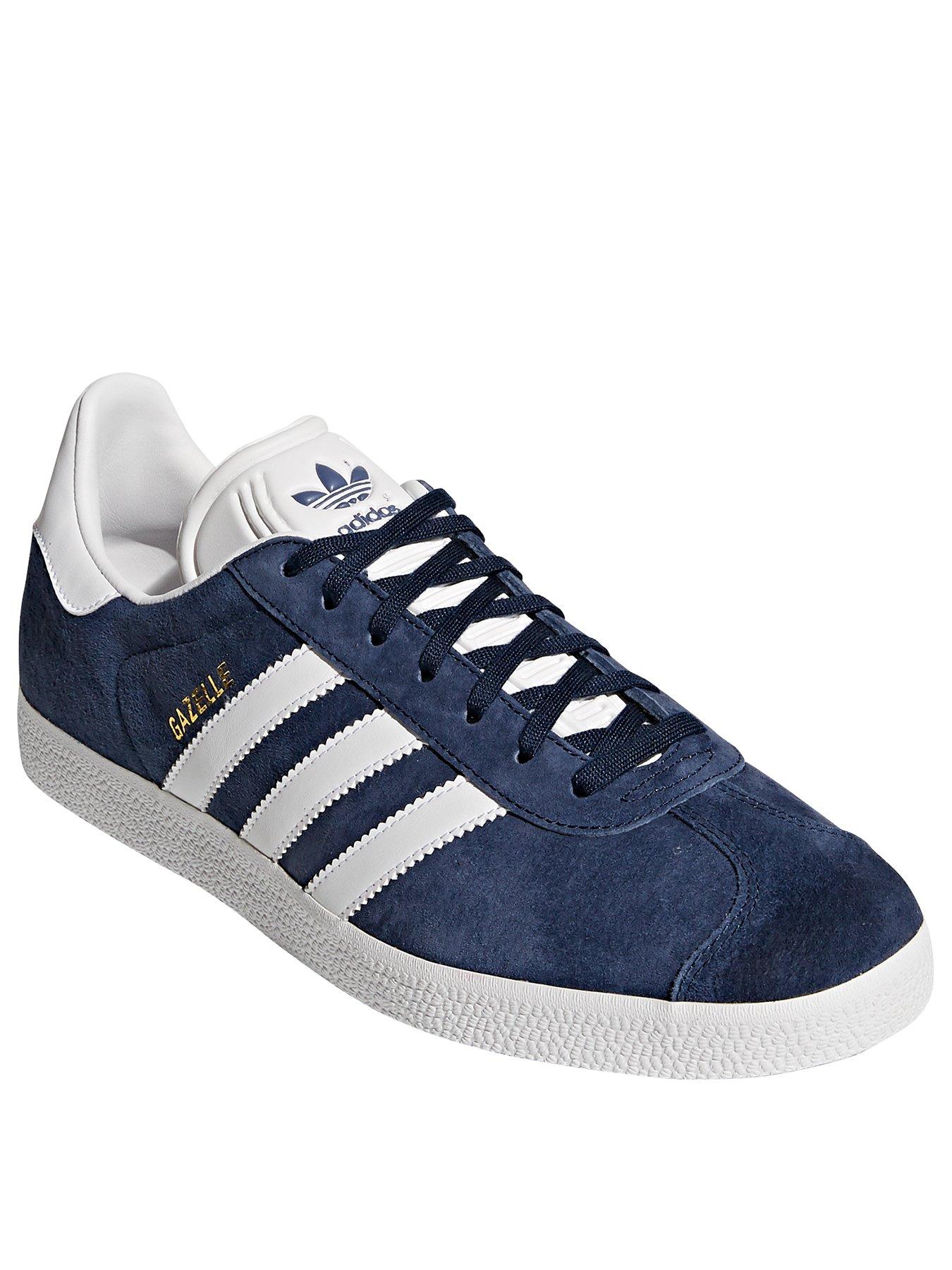 white and navy gazelle trainers