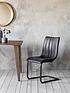  image of hometown-interiors-pair-of-araratnbspfaux-leather-dining-chairs-grey