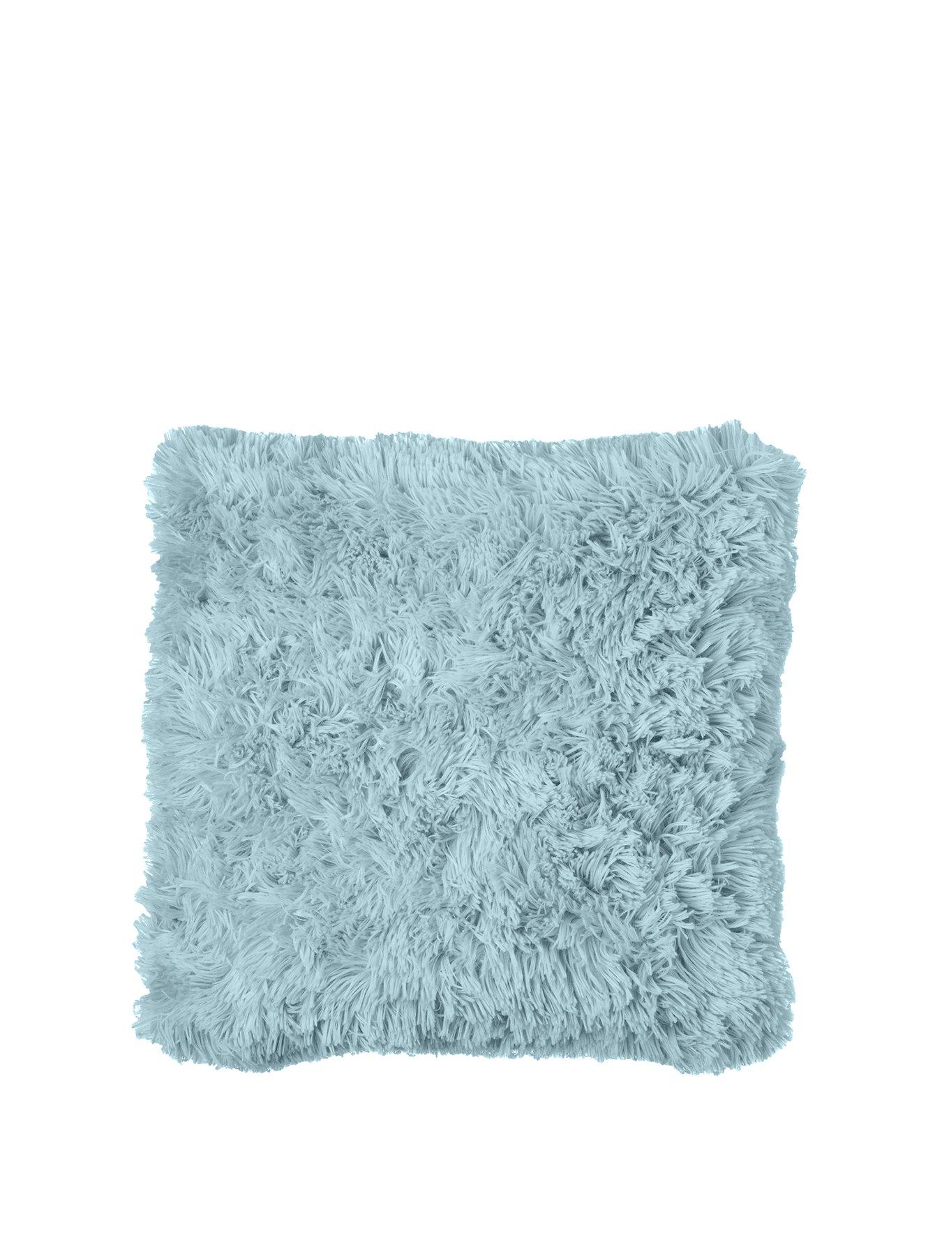 blue cushions and throws