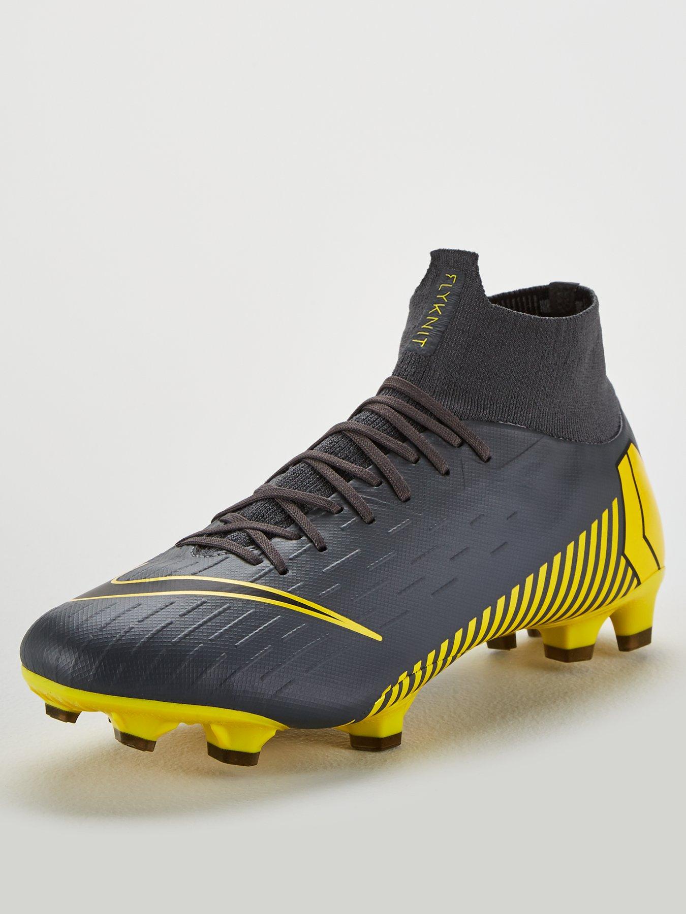 grey and yellow nike boots