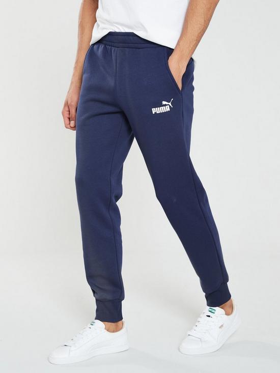 front image of puma-elevated-essentials-slim-joggers-blue