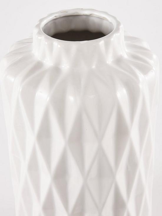 back image of glazed-white-faceted-vase