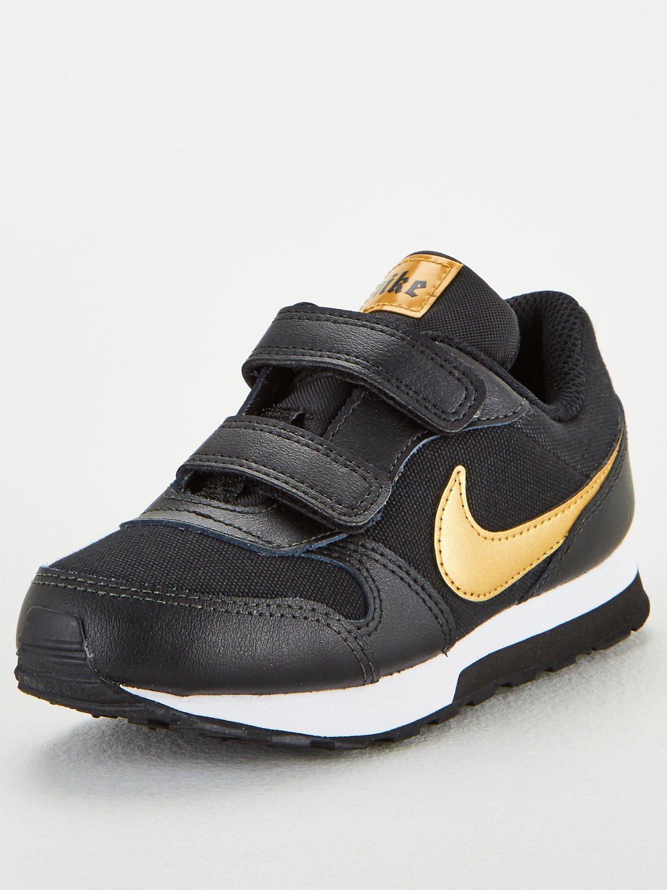 nike gold and black trainers