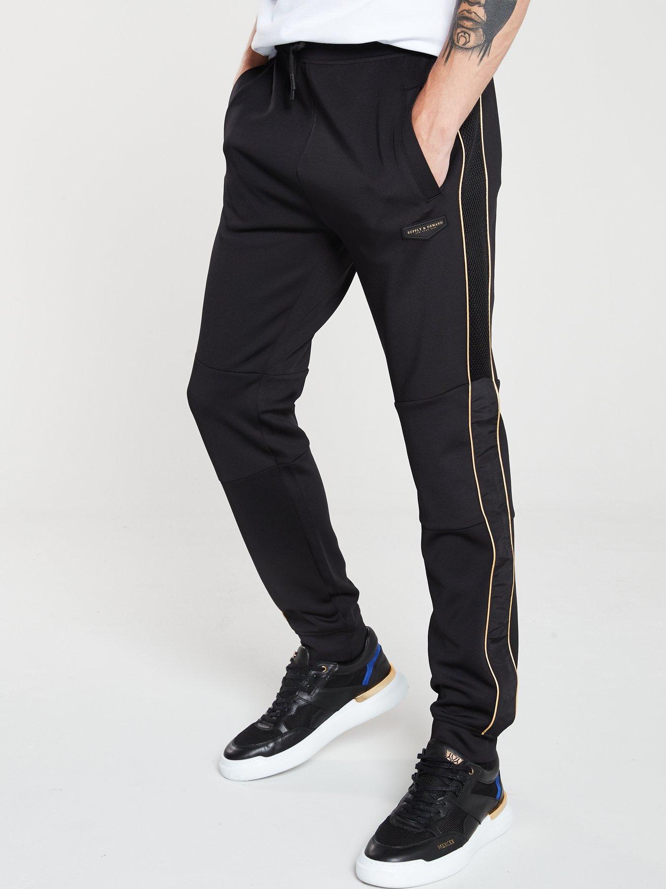 black and gold supply and demand tracksuit