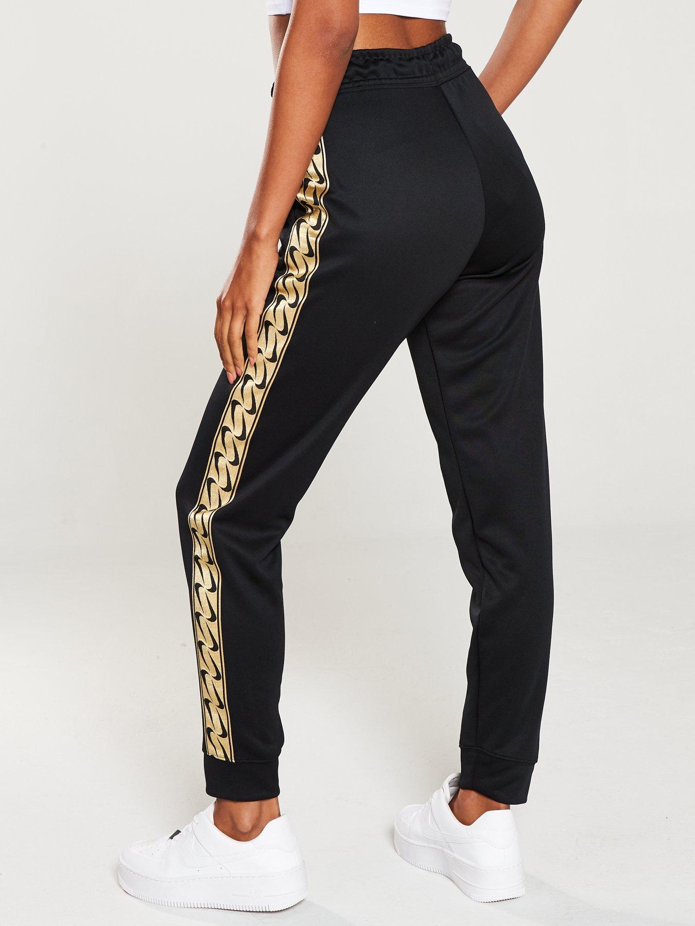 black and gold nike track pants