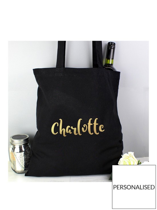 front image of the-personalised-memento-company-personalised-metallicnbspgold-name-black-canvas-bag