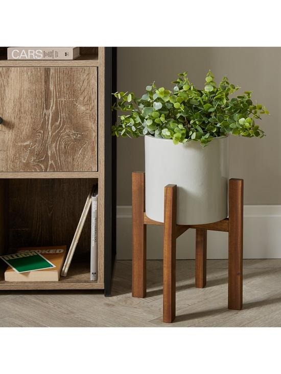 stillFront image of grey-ceramic-planter-on-wooden-stand
