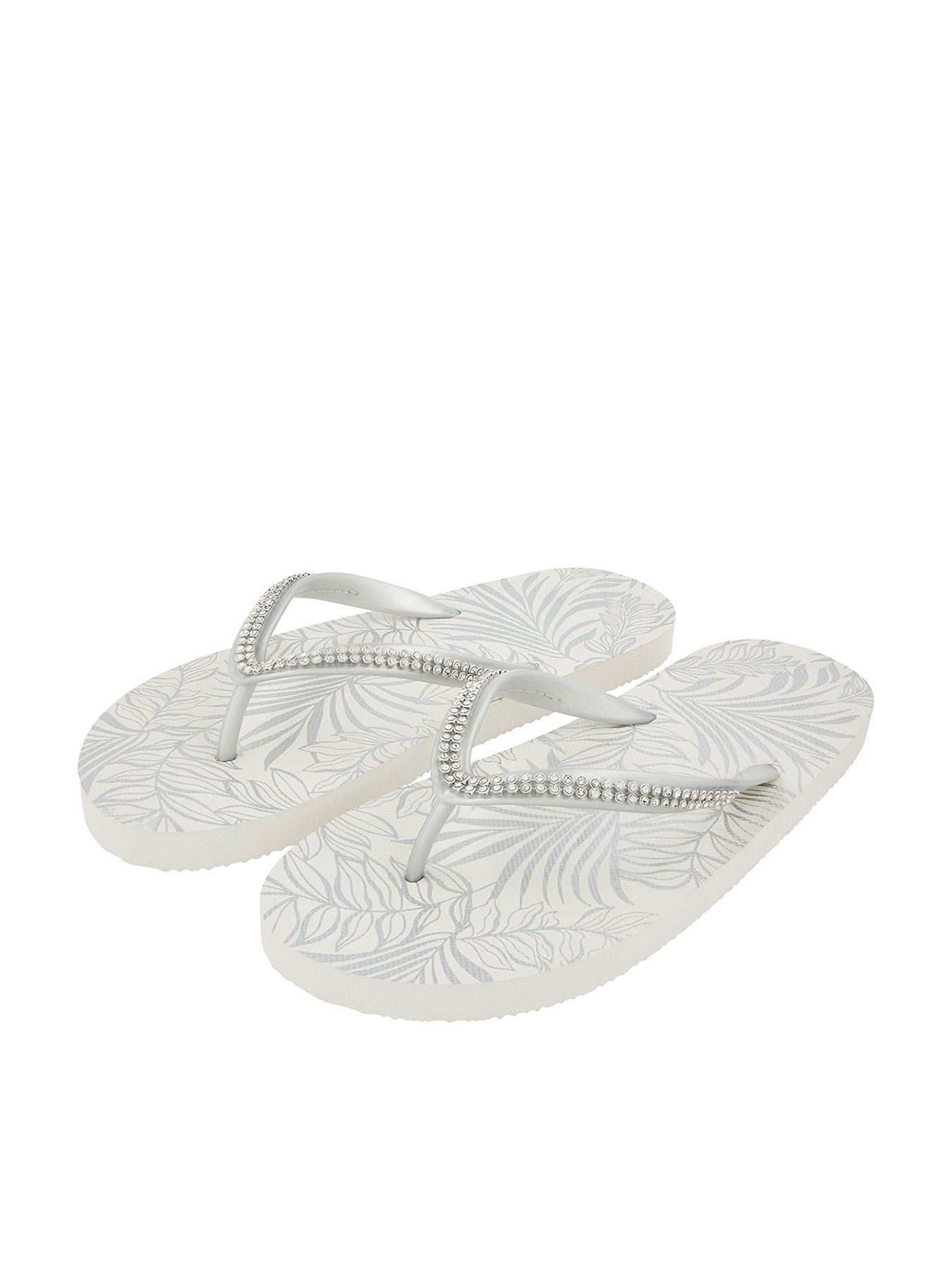 white embellished flip flops