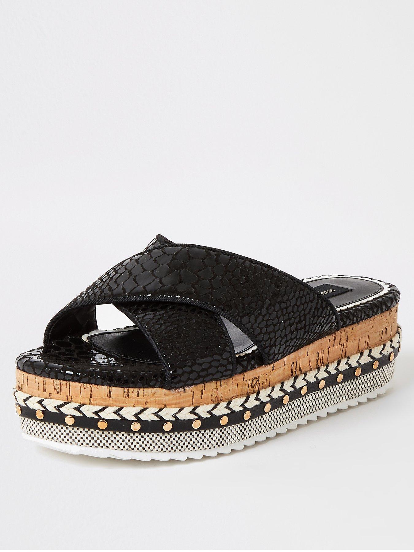 black and gold flatforms