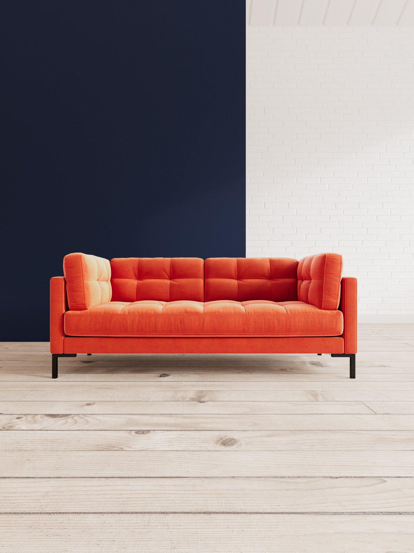 burnt orange two seater sofa