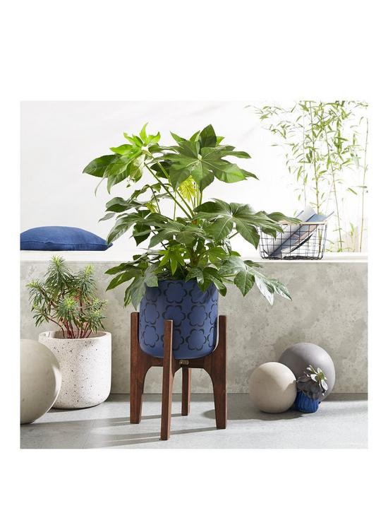front image of moroccan-pattern-planter-on-wooden-legs
