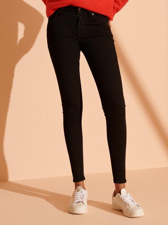 front image of superdry-mid-rise-skinny-jeans-black