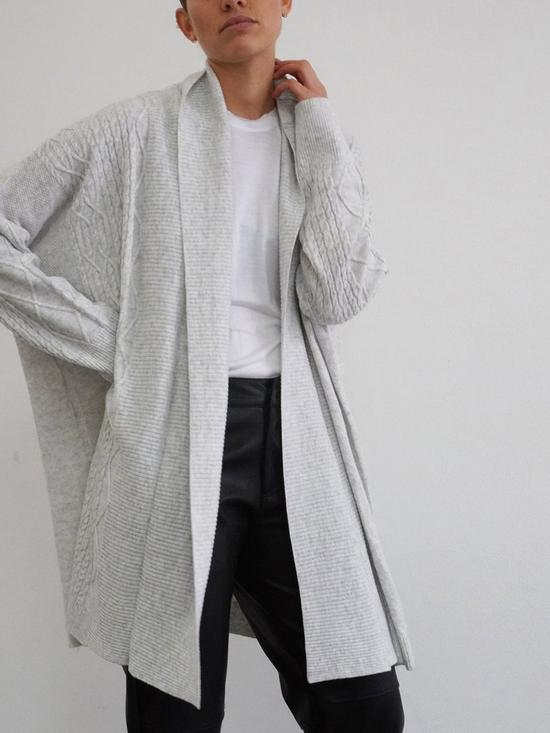front image of religion-passion-longline-cable-cardigan-grey