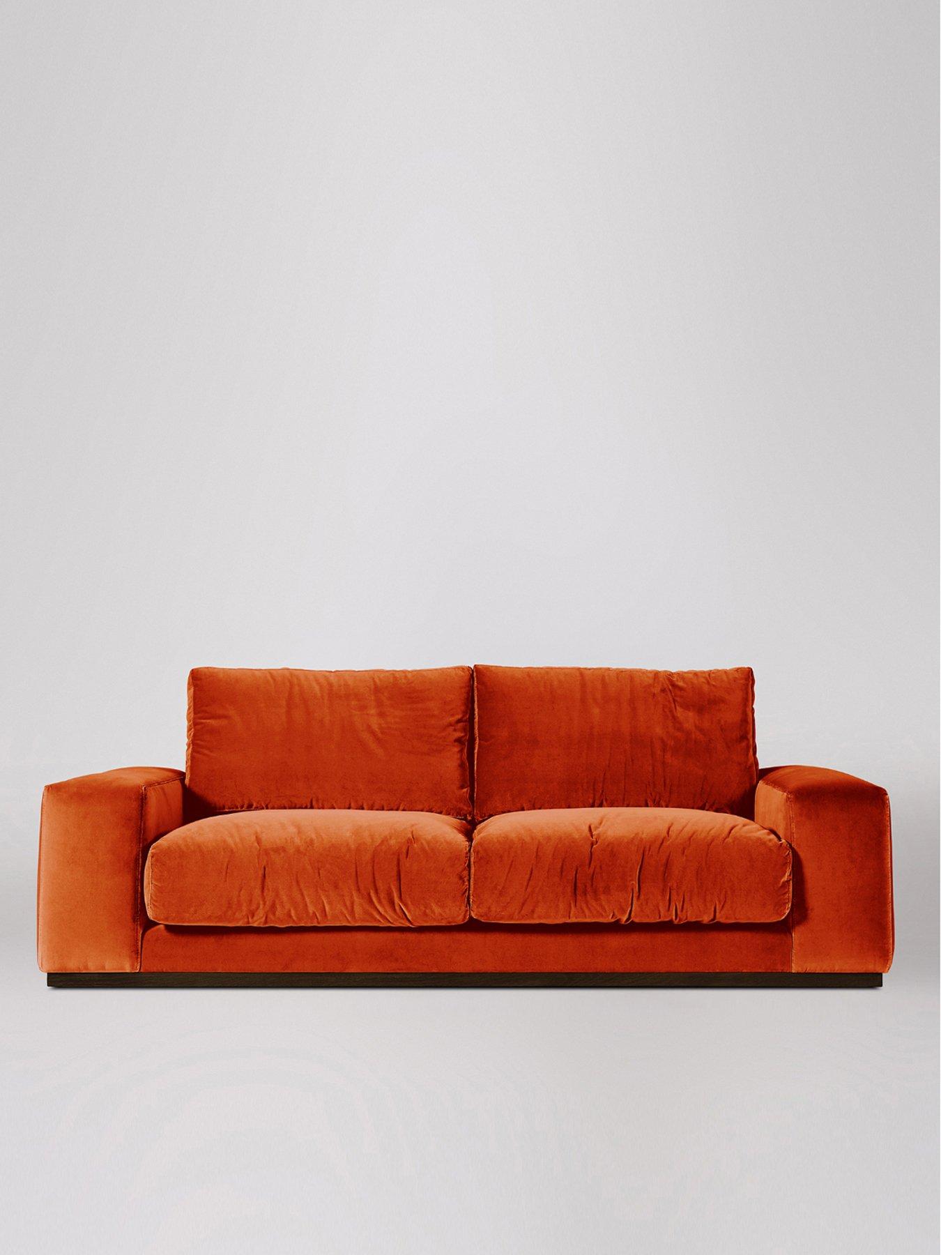 burnt orange two seater sofa