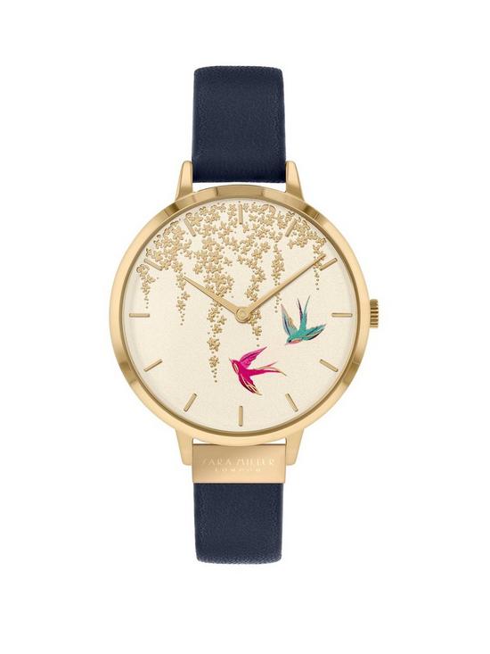 front image of sara-miller-white-and-gold-detail-swallow-dial-navy-leather-strap-ladies-watch