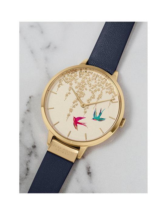 stillFront image of sara-miller-white-and-gold-detail-swallow-dial-navy-leather-strap-ladies-watch