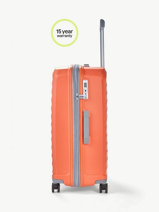 back image of rock-luggage-sunwave-medium-8-wheel-suitcase-peach