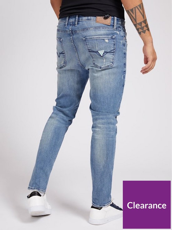 stillFront image of guess-jeans-drake-tapered-5-pocket-low-rise-jean