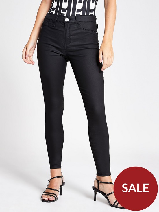 front image of ri-petite-coated-mid-rise-molly-jegging-black
