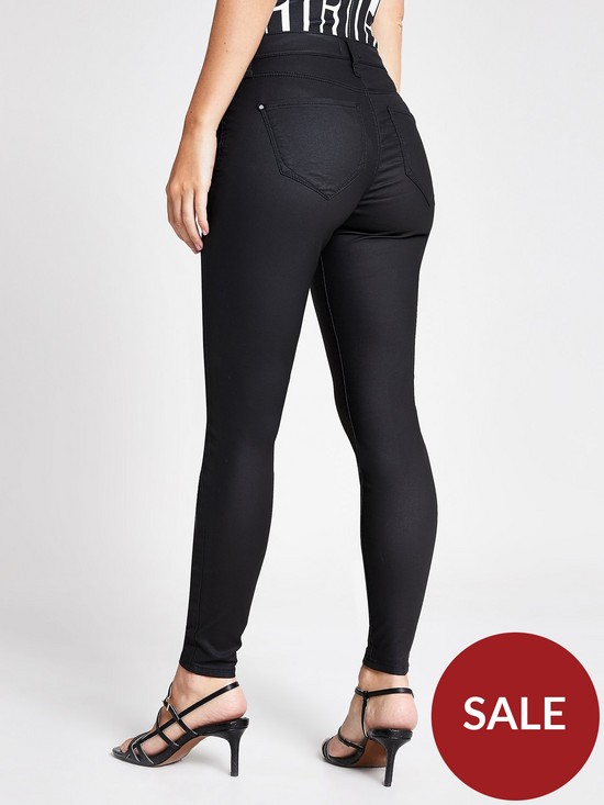 stillFront image of ri-petite-coated-mid-rise-molly-jegging-black