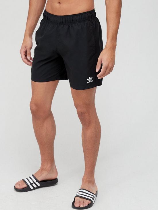 front image of adidas-originals-essentials-swim-shorts-black