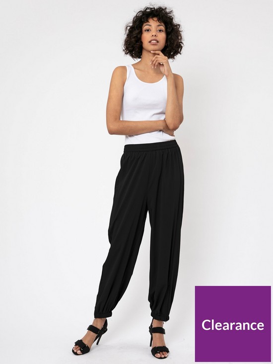 front image of religion-crepe-cuffed-trouser-black