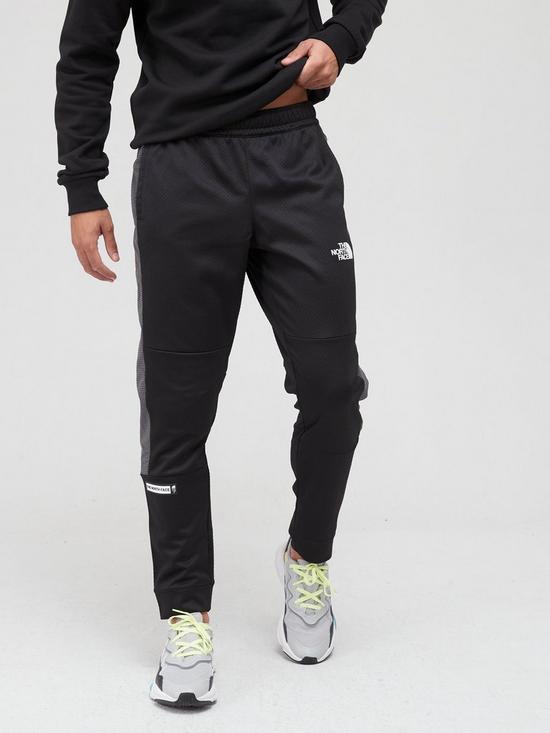 front image of the-north-face-mountain-athletics-cuffed-joggers-black