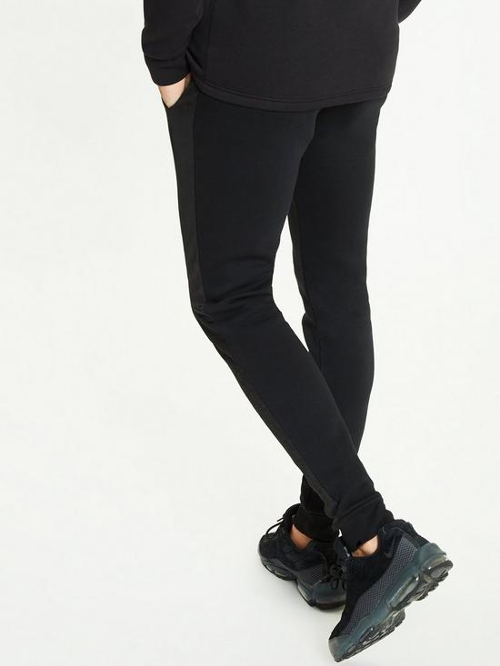 stillFront image of 11-degrees-mixed-fabric-cut-and-sew-printed-skinny-fit-joggers-black