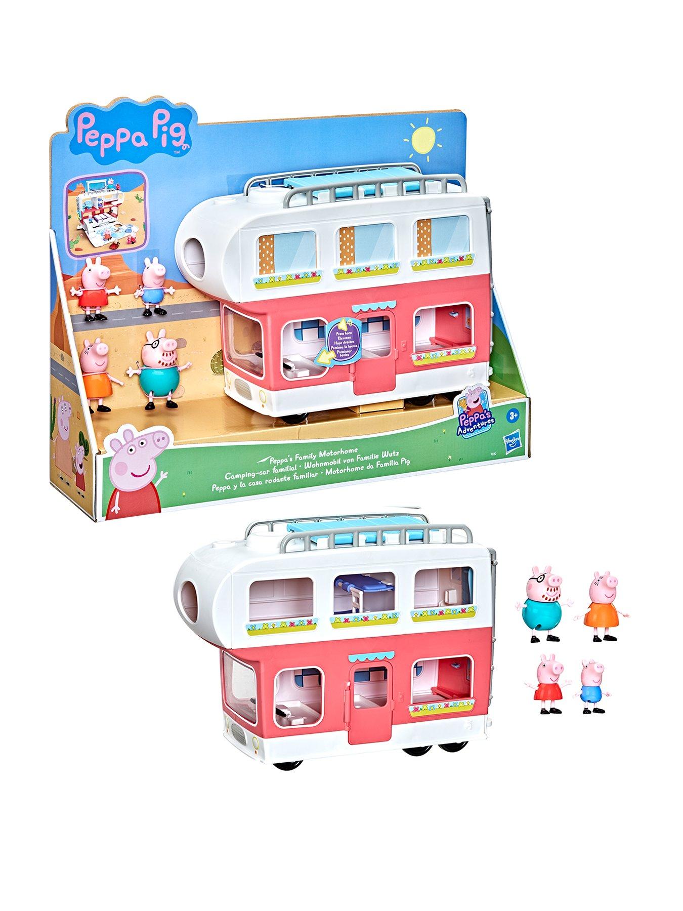 A plastic Peppa Pig toy play house standing on a table Stock Photo