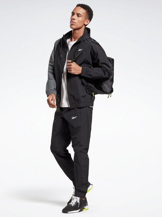 front image of reebok-techstyle-tracksuit