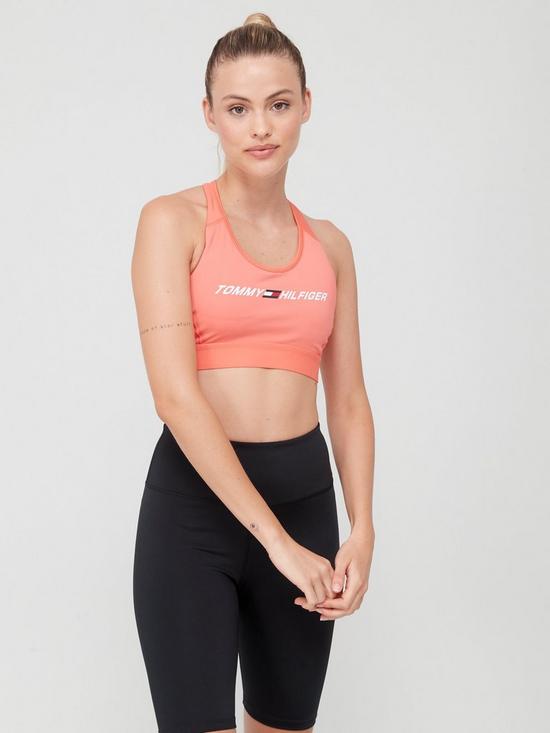 front image of tommy-sport-performance-mid-intensity-graphic-racer-bra-coral