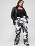  image of calvin-klein-curve-recycled-printed-wide-leg-trouser-black