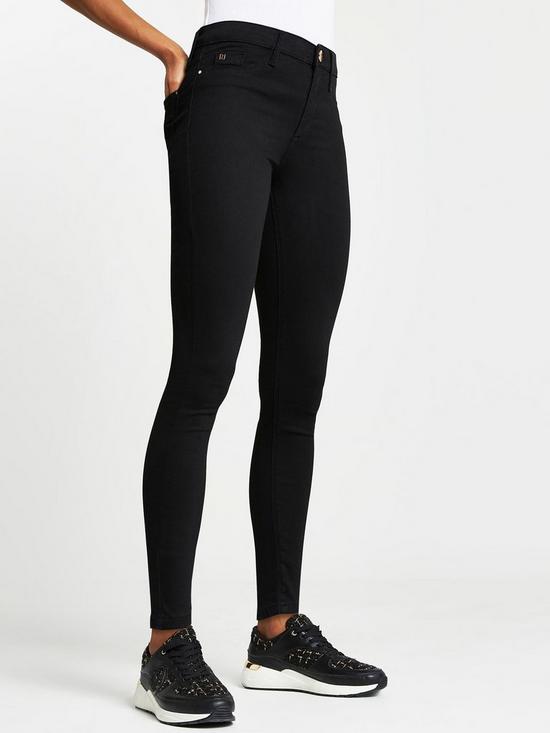 front image of river-island-molly-mid-rise-skinnynbspjeansnbsp--black