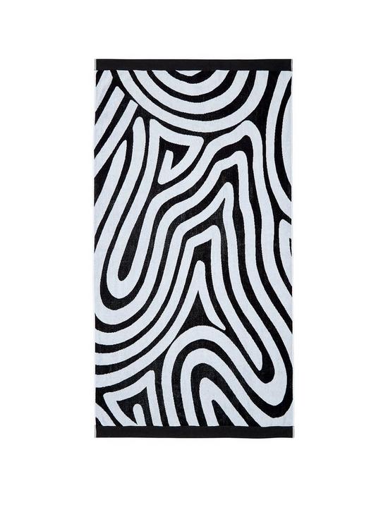 front image of nalu-nicole-scherzinger-makai-towels-beach-black-white