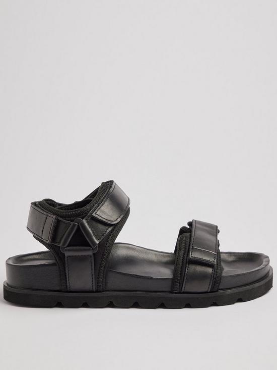 front image of pod-poppy-flat-sandals-black