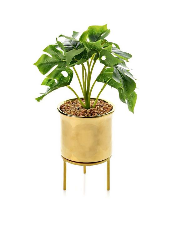 front image of hestia-gold-footed-planter-with-faux-plant