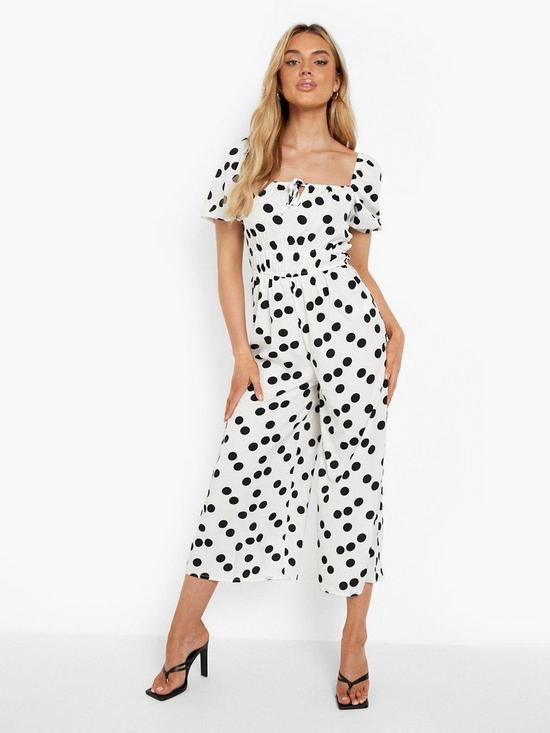 front image of boohoo-polka-tie-front-puff-sleeve-culotte-jumpsuit