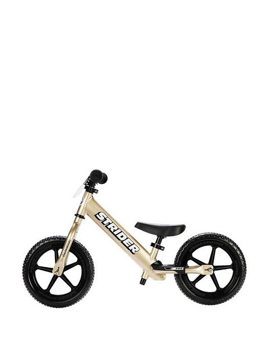 front image of strider-12-pro-balance-bike-gold