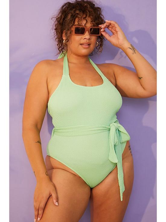 front image of in-the-style-curve-billie-faiers-green-crinkle-tie-belted-swimsuit