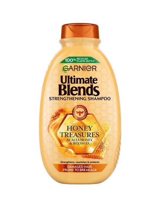 front image of garnier-ultimate-blends-honey-treasures-strengthening-vegan-shampoo-for-damaged-hair-enriched-with-acacia-honey-amp-beeswax-400ml