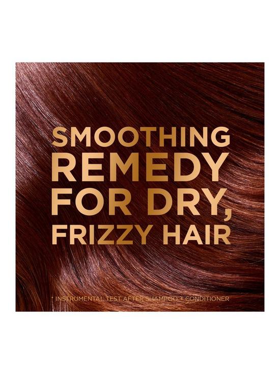 stillFront image of garnier-ultimate-blends-coconut-oil-amp-cocoa-butter-smoothing-and-nourishing-shampoo-for-frizzy-and-curly-hair-400ml