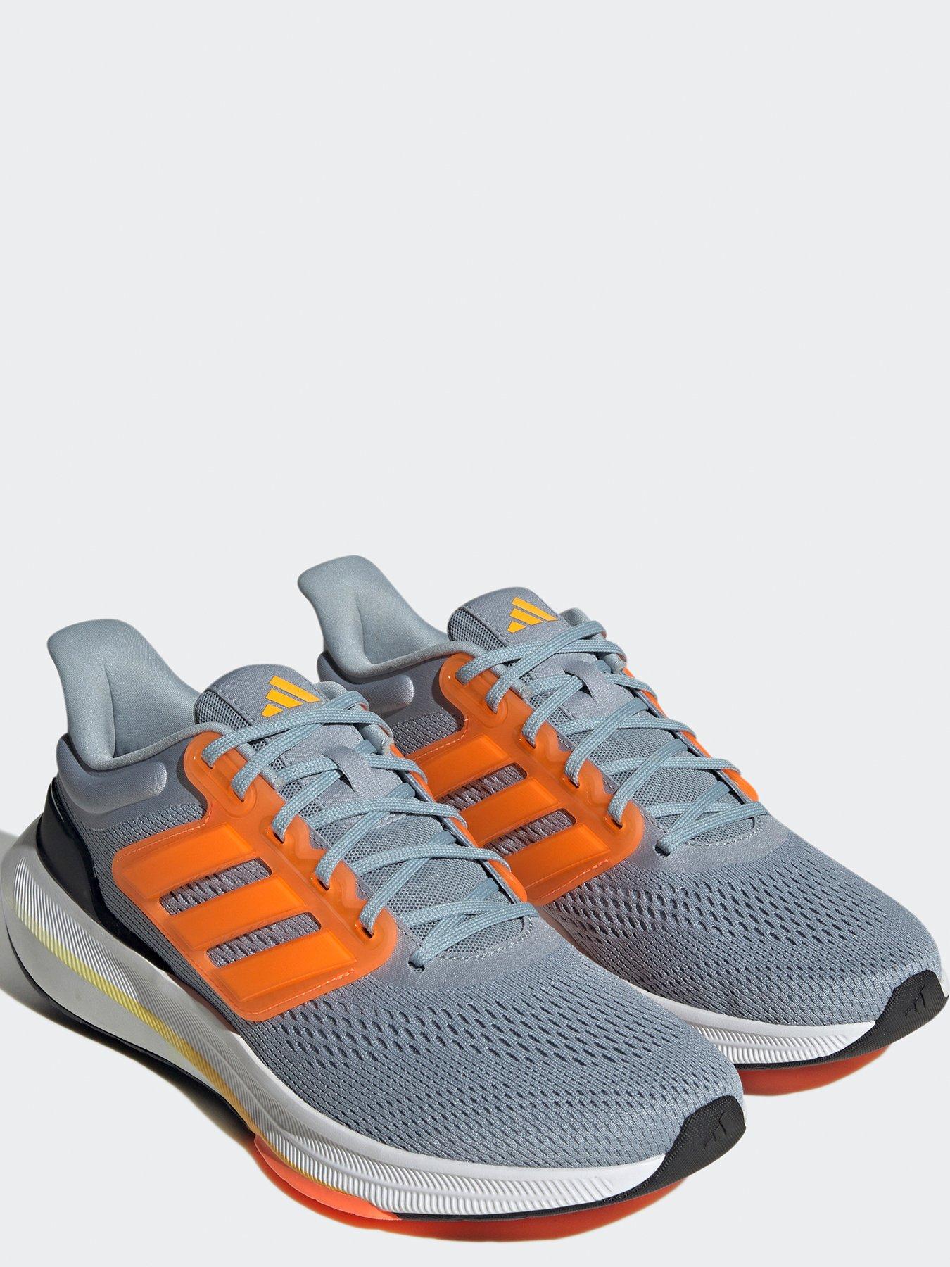 Adidas grey store and orange trainers