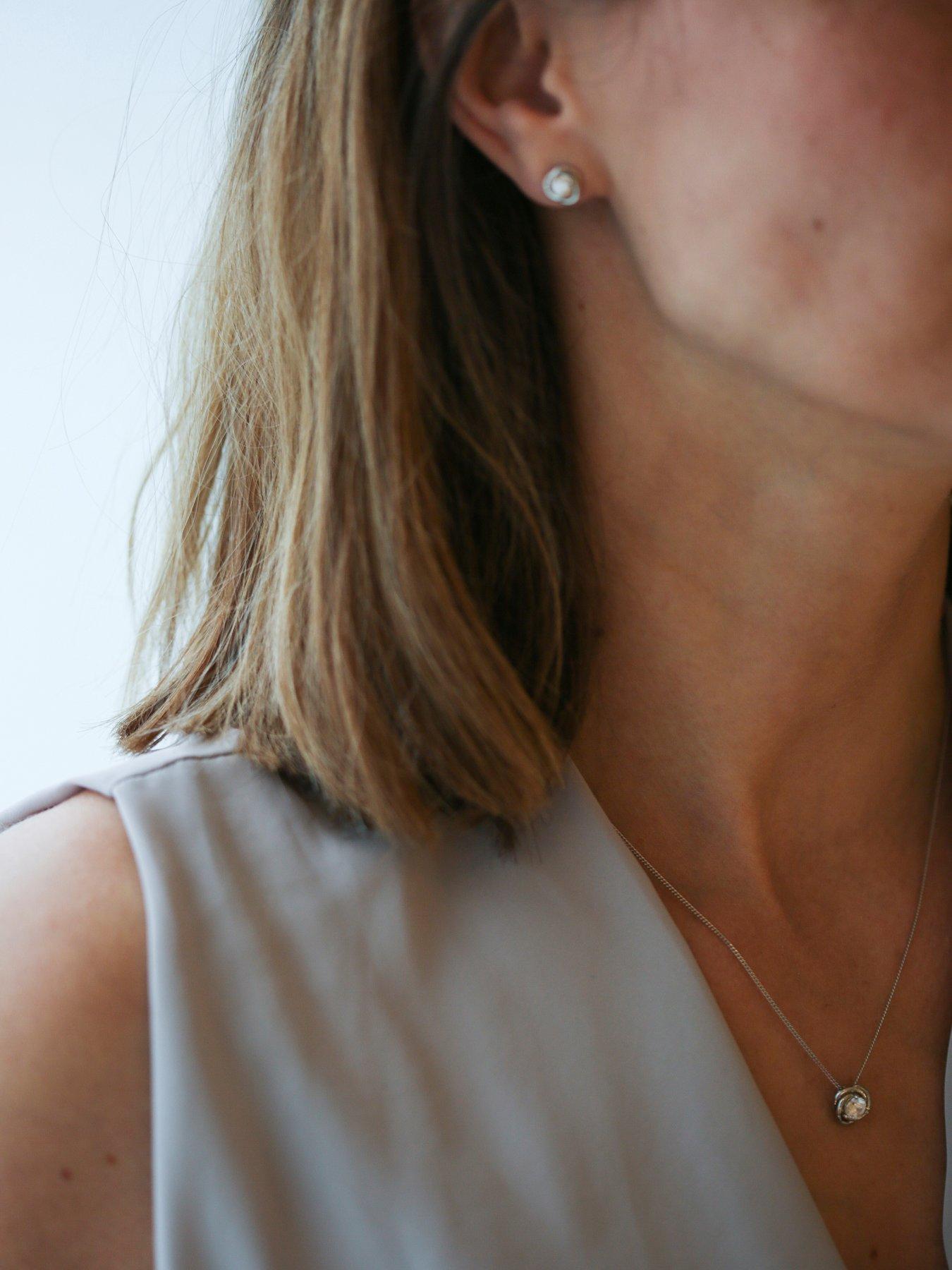  image of the-love-silver-collection-sterling-silver-cubic-zirconia-10mm-knot-pendant-and-8mm-earring-set
