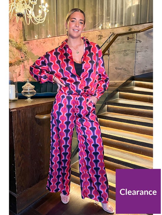 front image of in-the-style-x-gemma-atkinson-printed-flared-suit-trousers-pinkmulti