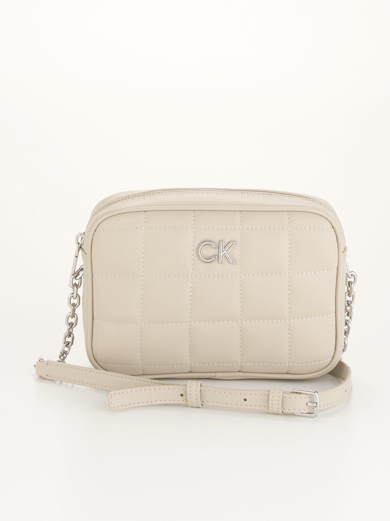 front image of calvin-klein-quilted-camera-bag-beige