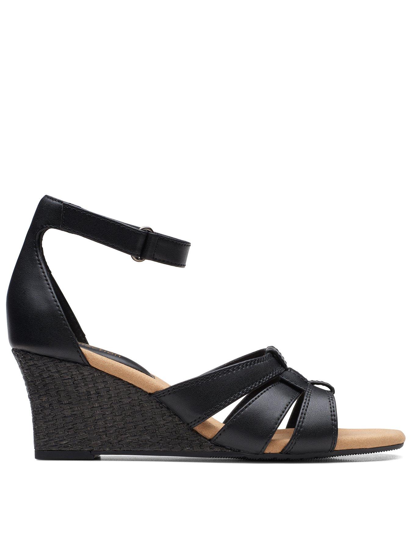  image of clarks-kyarra-joy-wide-fit-wedges-black-leather
