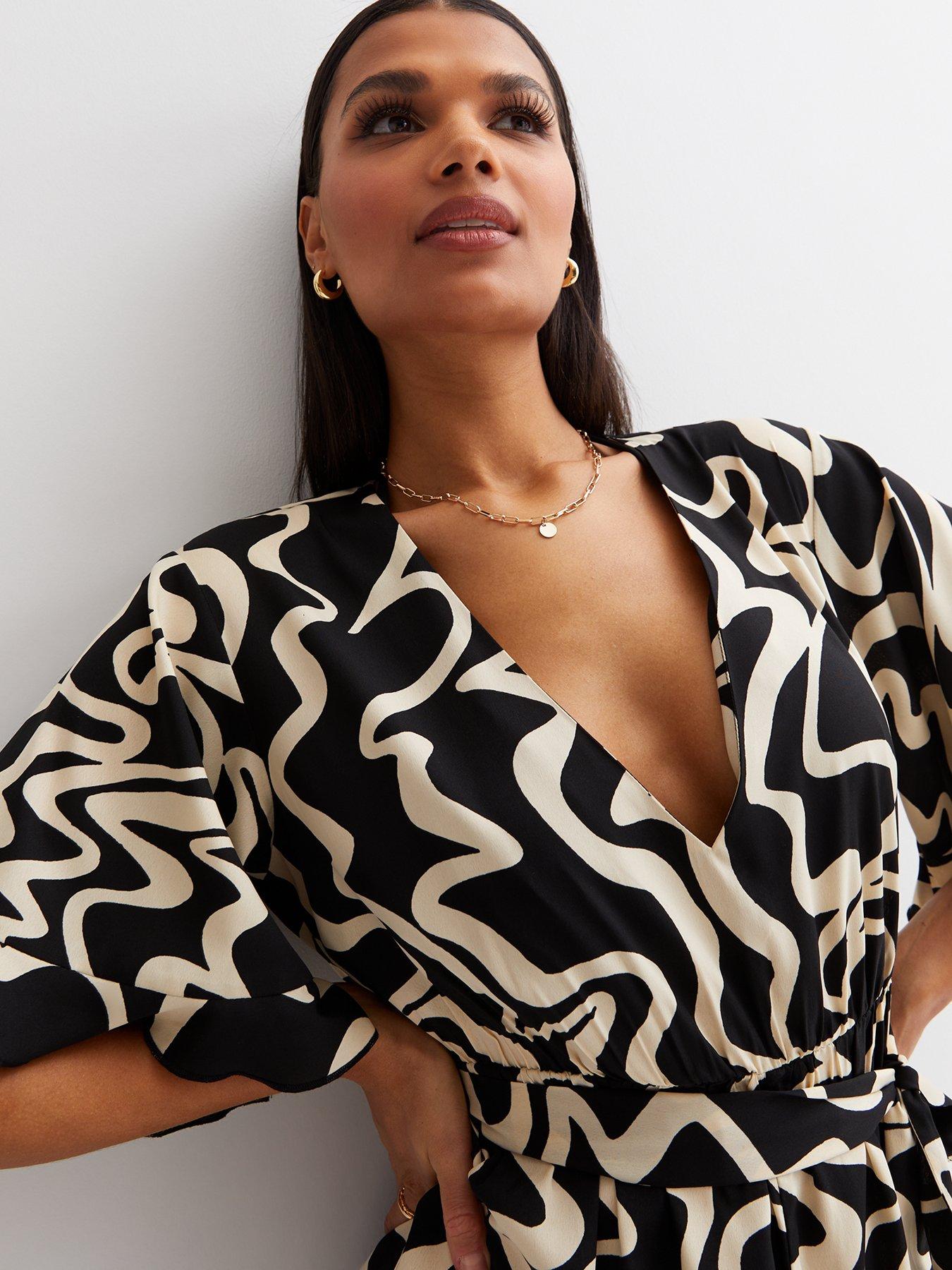  image of new-look-black-marble-v-neck-short-sleeve-tie-waist-playsuit