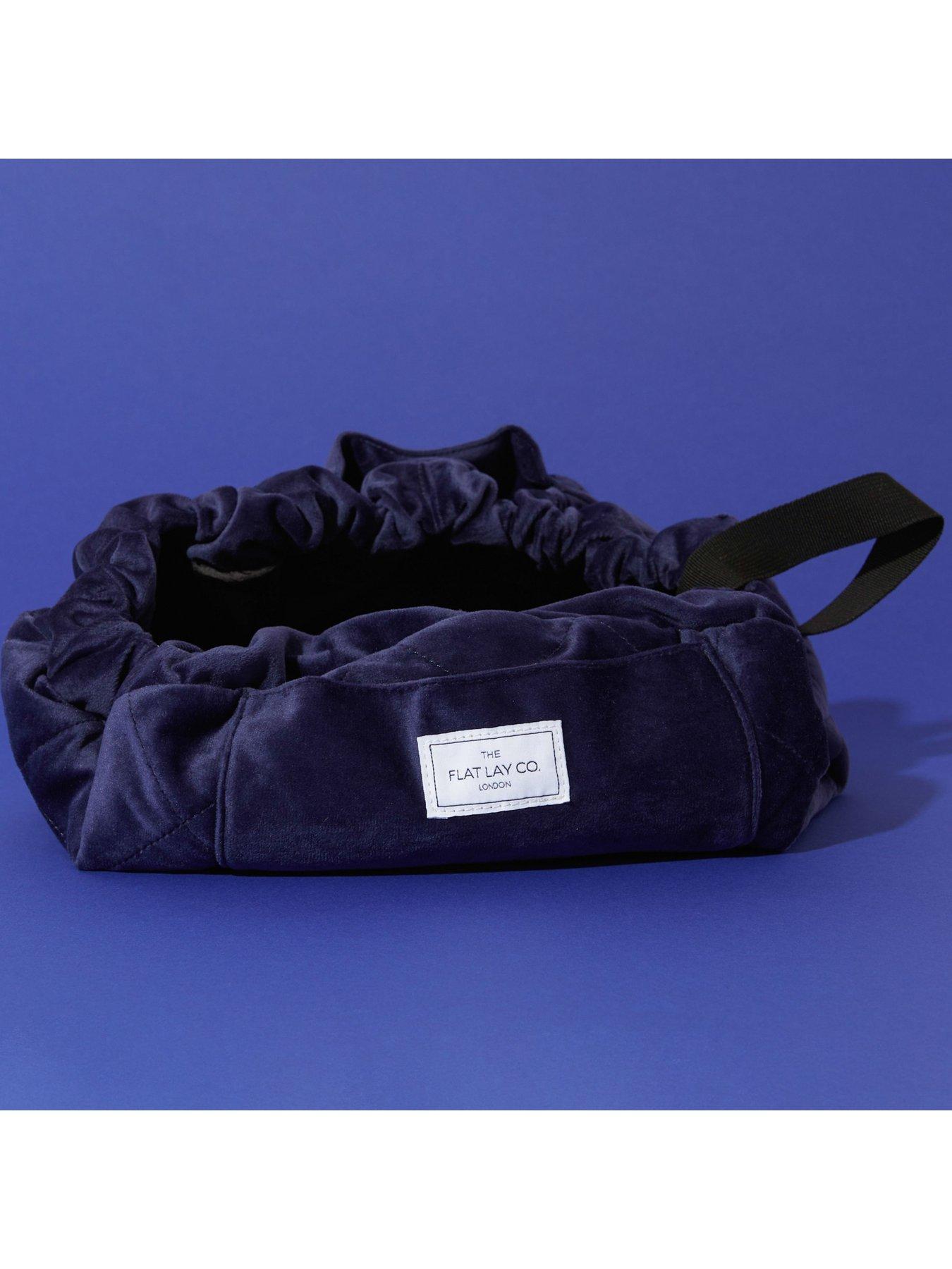  image of the-flat-lay-co-navy-velvet-open-flat-makeup-bag
