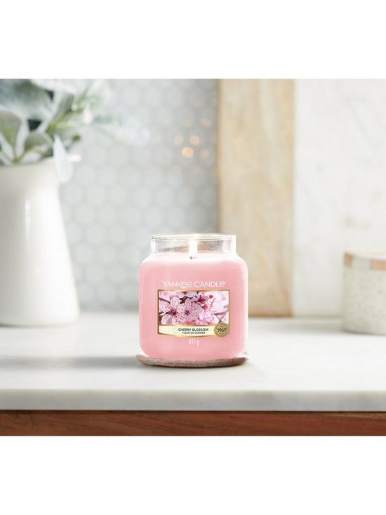 stillFront image of yankee-candle-classic-medium-jar-candle-ndash-cherry-blossom
