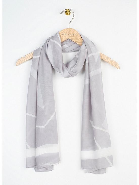 back image of mint-velvet-star-print-lightweight-scarf